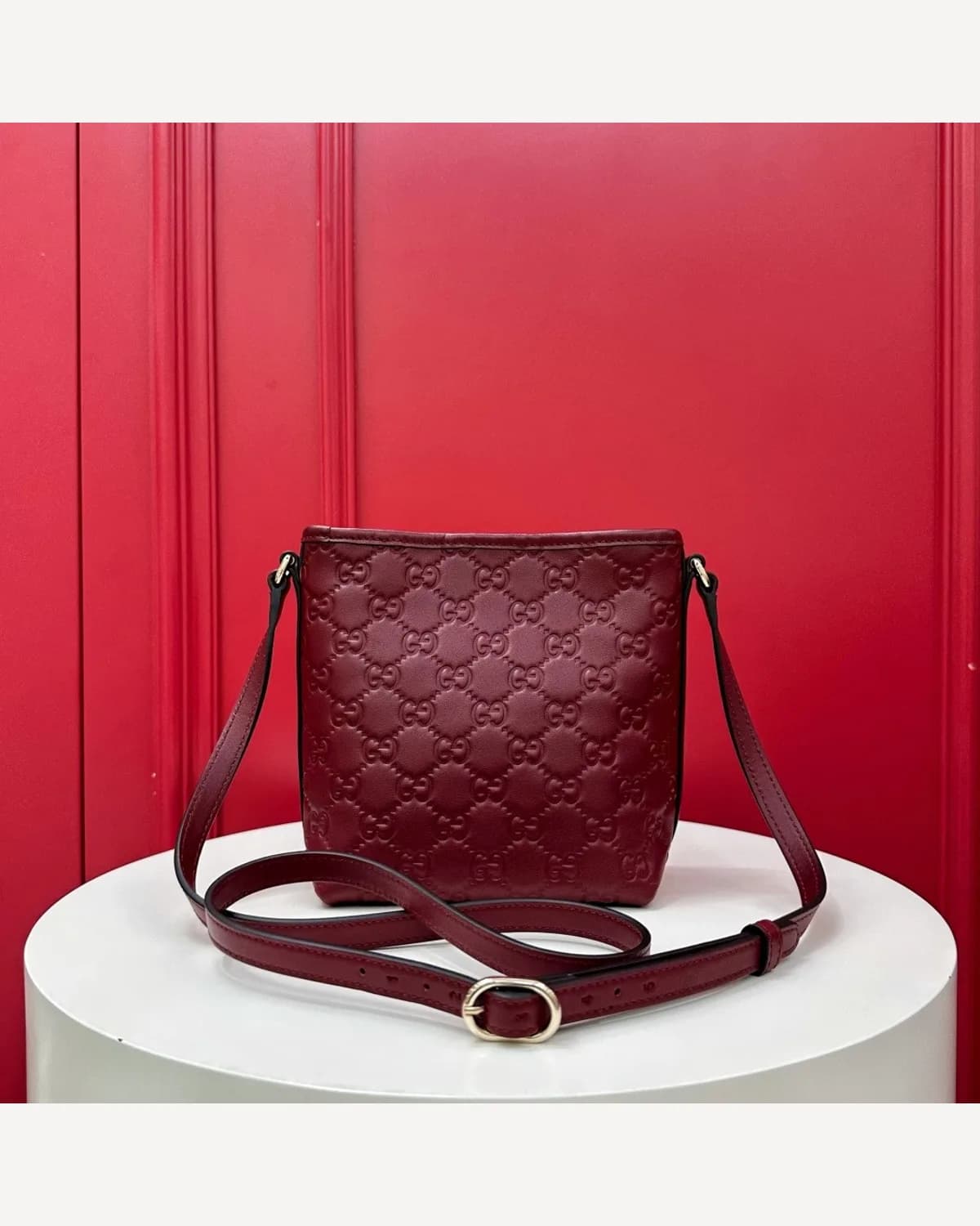 Gucci GG Embossed Bucket Bag — Burgundy