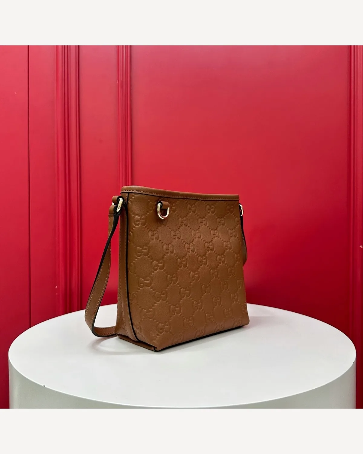 Gucci GG Embossed Bucket Bag — Tan