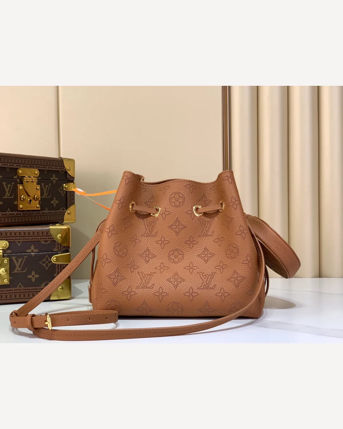 Louis Vuitton Bucket — Tan Embossed